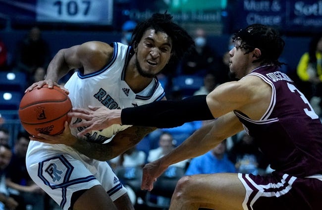 URI guard Brayon Freeman pulls the ball away from Fordham defender Darius Quisenberry in the first half.