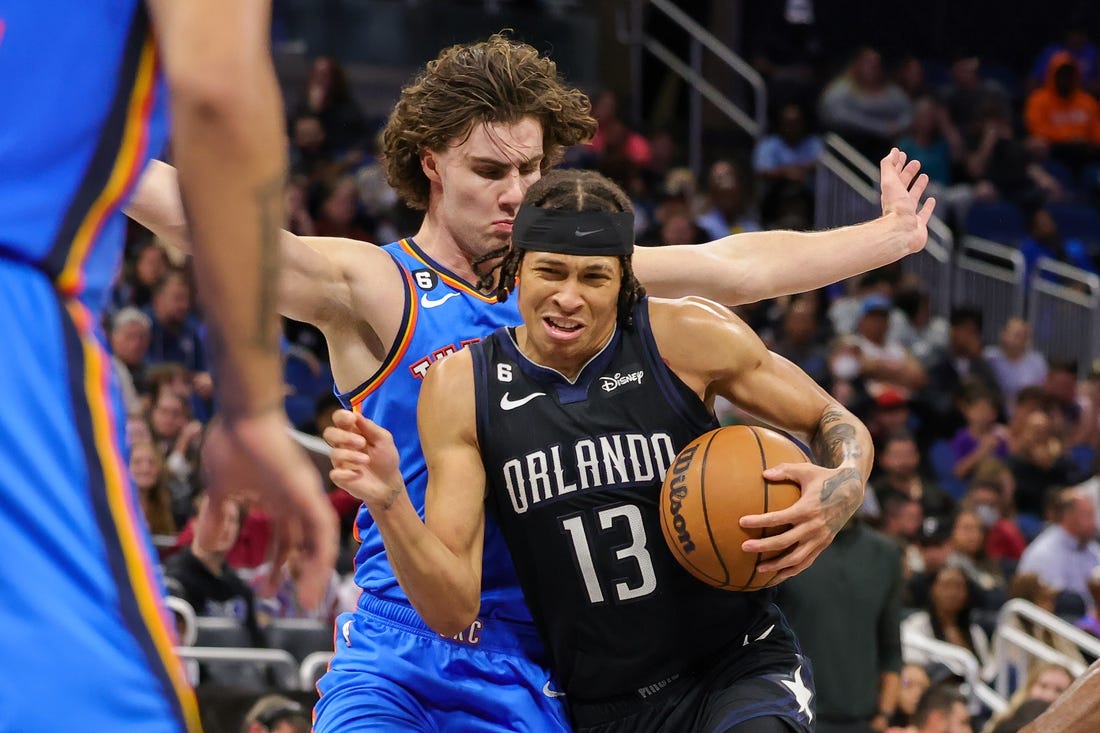 Jan 4, 2023; Orlando, Florida, USA; Orlando Magic guard R.J. Hampton (13) is fouled by Oklahoma City Thunder guard Josh Giddey (3) during the second half at Amway Center. Mandatory Credit: Mike Watters-USA TODAY Sports