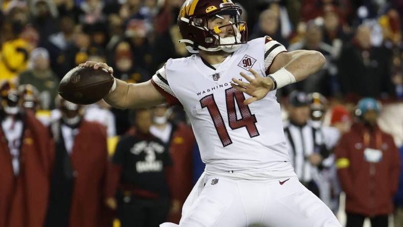 Jan 8, 2023; Landover, Maryland, USA; Washington Commanders quarterback Sam Howell (14) passes the ball against the Dallas Cowboys at FedExField. Mandatory Credit: Geoff Burke-USA TODAY Sports