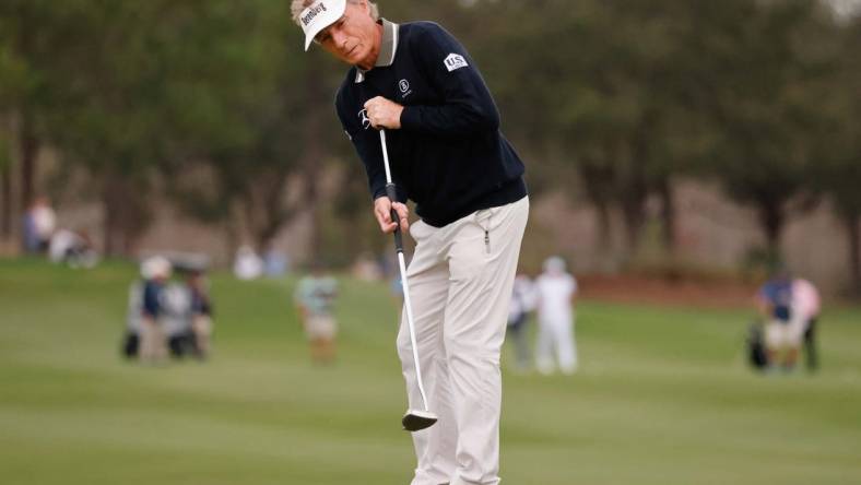 Dec 17, 2022; Orlando, Florida, USA;  Bernhard Langer putts on the 18th green during the first round of the PNC Championship golf tournament at Ritz Carlton Golf Club Grande Lakes Orlando Course. Mandatory Credit: Reinhold Matay-USA TODAY Sports