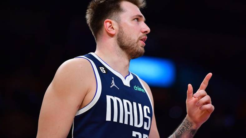 Jan 12, 2023; Los Angeles, California, USA; Dallas Mavericks guard Luka Doncic (77) reacts against the Los Angeles Lakers during the first half at Crypto.com Arena. Mandatory Credit: Gary A. Vasquez-USA TODAY Sports