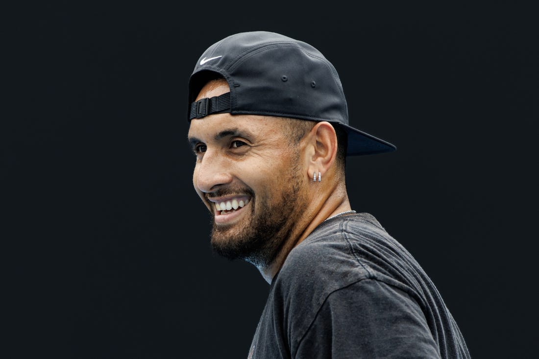 Jan 15, 2023; Melbourne, Victoria, Australia; Nick Kyrgios of Australia laughs during a practice session on court 16 at Melbourne Park. Mandatory Credit: Mike Frey-USA TODAY Sports