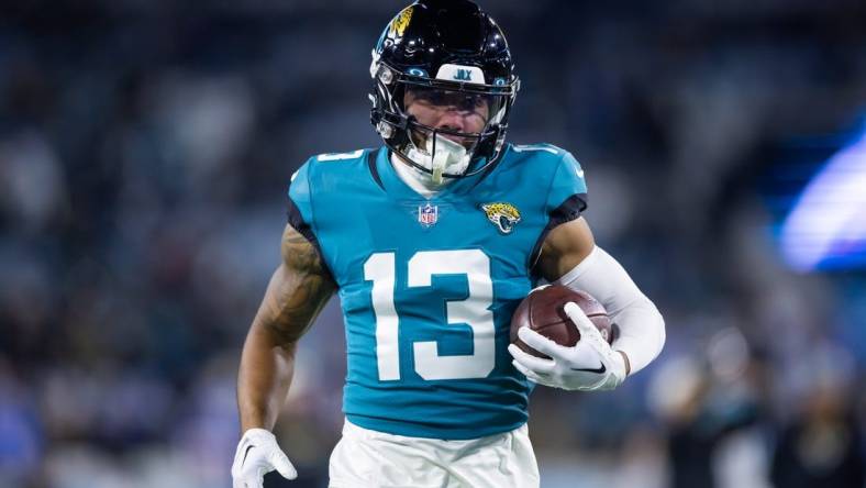 Jan 14, 2023; Jacksonville, Florida, USA; Jacksonville Jaguars wide receiver Christian Kirk (13) against the Los Angeles Chargers during a wild card playoff game at TIAA Bank Field. Mandatory Credit: Mark J. Rebilas-USA TODAY Sports