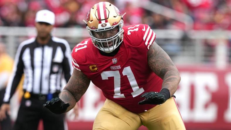 Jan 8, 2023; Santa Clara, California, USA; San Francisco 49ers offensive tackle Trent Williams (71) blocks against the Arizona Cardinals during the second quarter at Levi's Stadium. Mandatory Credit: Darren Yamashita-USA TODAY Sports