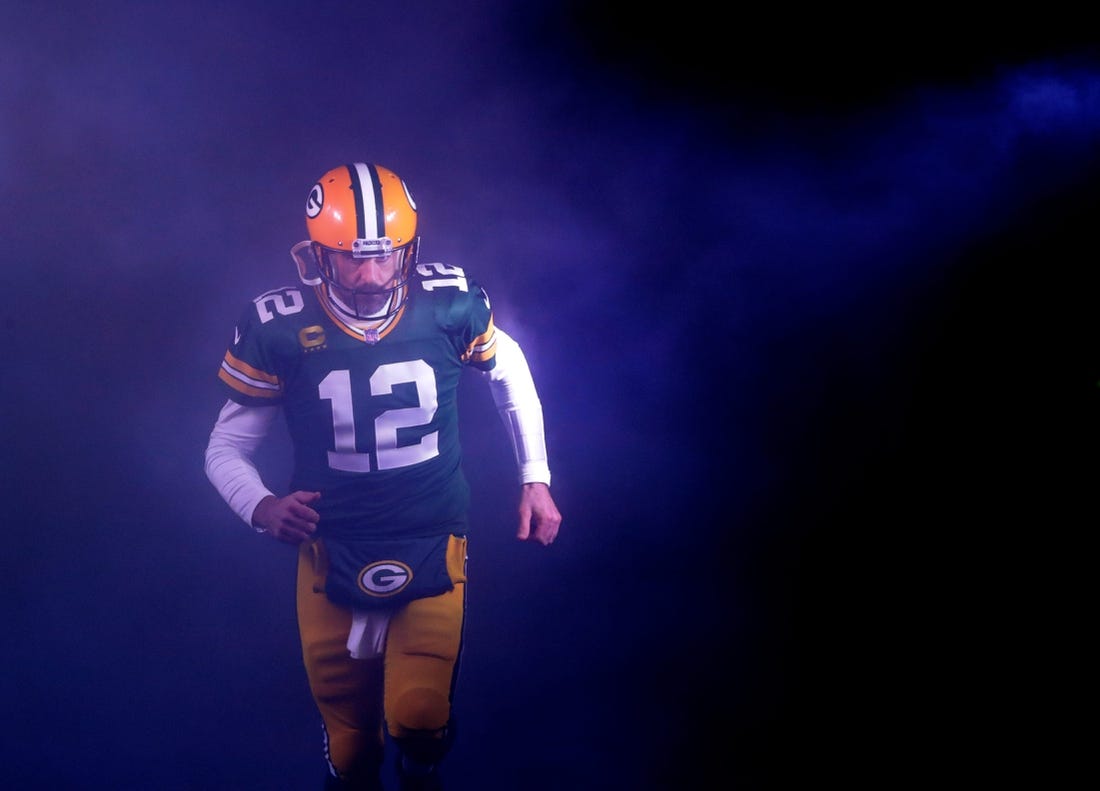 Green Bay Packers quarterback Aaron Rodgers (12) runs out on to the field as he is announced against the Detroit Lions during their football game Sunday, Jan. 8, 2023, at Lambeau Field in Green Bay, Wis.

Apc Packvsdetroit 0108230308djpa