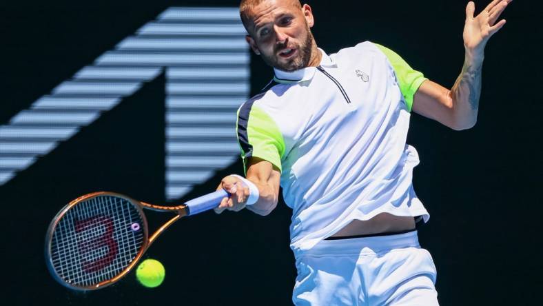 Jan 21, 2023; Melbourne, VICTORIA, Australia; Daniel Evans from Great Britain during his third round match against Andrey Rublev from Russia on day six of the 2023 Australian Open tennis tournament at Melbourne Park. Mandatory Credit: Mike Frey-USA TODAY Sports