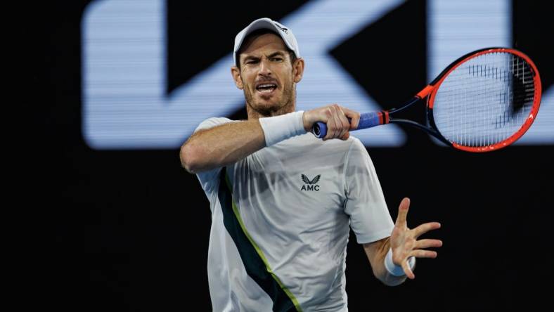 Jan 21, 2023; Melbourne, Victoria, Australia;   Andy Murray of Great Britain hits a forehand against Roberto Bautista-Agut of Spain on day six of the 2023 Australian Open tennis tournament at Melbourne Park. Mandatory Credit: Mike Frey-USA TODAY Sports