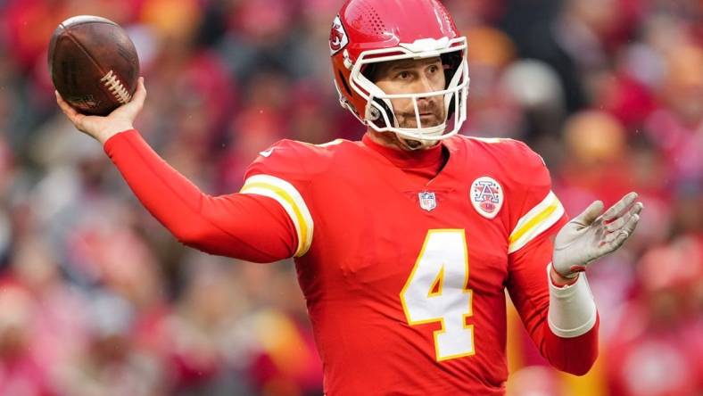 Jan 21, 2023; Kansas City, Missouri, USA; Kansas City Chiefs quarterback Chad Henne (4) throws a pass during the first half of an AFC divisional round game against the Jacksonville Jaguars at GEHA Field at Arrowhead Stadium. Mandatory Credit: Jay Biggerstaff-USA TODAY Sports