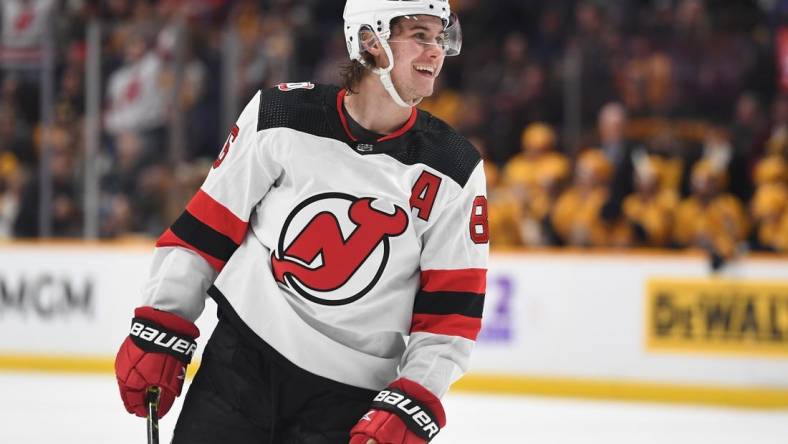 Jan 26, 2023; Nashville, Tennessee, USA; New Jersey Devils center Jack Hughes (86) celebrate after a goal during the second period against the Nashville Predators at Bridgestone Arena. Mandatory Credit: Christopher Hanewinckel-USA TODAY Sports