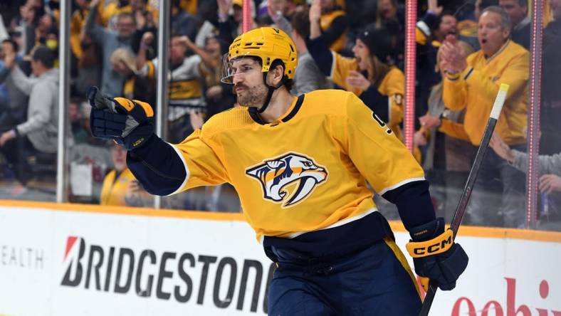 Jan 26, 2023; Nashville, Tennessee, USA; Nashville Predators left wing Filip Forsberg (9) celebrates after a goal against New Jersey Devils goaltender Mackenzie Blackwood (not pictured) during the third period at Bridgestone Arena. Mandatory Credit: Christopher Hanewinckel-USA TODAY Sports