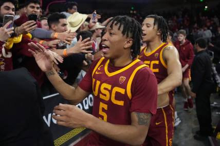 Jan 26, 2023; Los Angeles, California, USA; Southern California Trojans guard Boogie Ellis (5) celebrates with fans after the game against the UCLA Bruins at Galen Center. Mandatory Credit: Kirby Lee-USA TODAY Sports