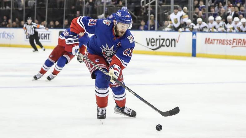 Jan 27, 2023; New York, New York, USA;  New York Rangers center Barclay Goodrow (21) chases the puck in the second period against the Vegas Golden Knights at Madison Square Garden. Mandatory Credit: Wendell Cruz-USA TODAY Sports