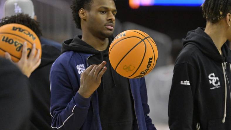 Jan 27, 2023; Los Angeles, CA, USA;  Sierra Canyon Trailblazers point guard Bronny James (0) looks on during warm up for the Battle of the Valley against the Notre Dame Knights played at Pauley Pavilion. James did not play because of a knee injury. Mandatory Credit: Jayne Kamin-Oncea-USA TODAY Sports