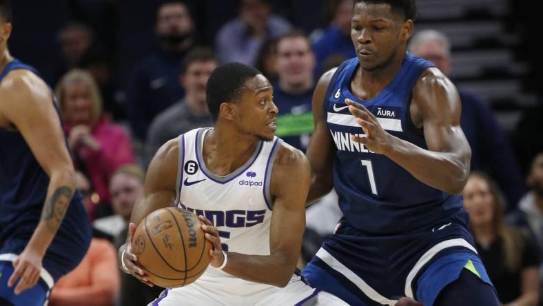 Jan 30, 2023; Minneapolis, Minnesota, USA; Sacramento Kings guard De'Aaron Fox (5) tries to work around Minnesota Timberwolves forward Anthony Edwards (1) in the fourth quarter at Target Center. Mandatory Credit: Bruce Kluckhohn-USA TODAY Sports