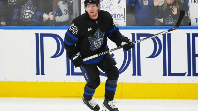 Jan 27, 2023; Toronto, Ontario, CAN; Toronto Maple Leafs defenseman Rasmus Sandin (38) skates against the Ottawa Senators during the warmup at Scotiabank Arena. Mandatory Credit: Nick Turchiaro-USA TODAY Sports