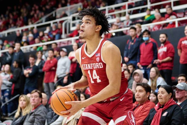 Jan 21, 2023; Stanford, California, USA; Stanford Cardinal forward Spencer Jones (14) holds the ball against the Oregon Ducks during the first half at Maples Pavilion. Mandatory Credit: Robert Edwards-USA TODAY Sports