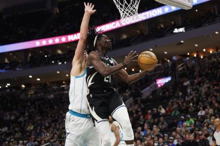 Jan 31, 2023; Milwaukee, Wisconsin, USA;  Milwaukee Bucks guard Jrue Holiday (21) shoots during the first quarter against the Charlotte Hornets at Fiserv Forum. Mandatory Credit: Jeff Hanisch-USA TODAY Sports