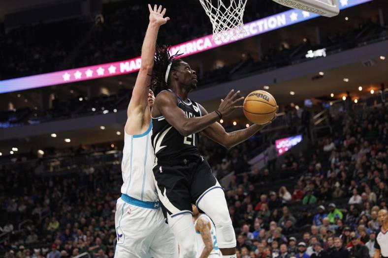 Jan 31, 2023; Milwaukee, Wisconsin, USA;  Milwaukee Bucks guard Jrue Holiday (21) shoots during the first quarter against the Charlotte Hornets at Fiserv Forum. Mandatory Credit: Jeff Hanisch-USA TODAY Sports