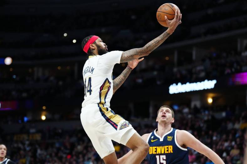 Jan 31, 2023; Denver, Colorado, USA; New Orleans Pelicans forward Brandon Ingram (14) shoots the ball in the first quarter against the Denver Nuggets at Ball Arena. Mandatory Credit: Ron Chenoy-USA TODAY Sports