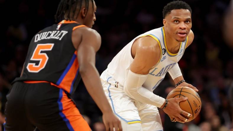 Jan 31, 2023; New York, New York, USA; Los Angeles Lakers guard Russell Westbrook (0) controls the ball against New York Knicks guard Immanuel Quickley (5) during overtime at Madison Square Garden. Mandatory Credit: Brad Penner-USA TODAY Sports