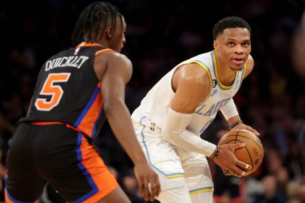 Jan 31, 2023; New York, New York, USA; Los Angeles Lakers guard Russell Westbrook (0) controls the ball against New York Knicks guard Immanuel Quickley (5) during overtime at Madison Square Garden. Mandatory Credit: Brad Penner-USA TODAY Sports