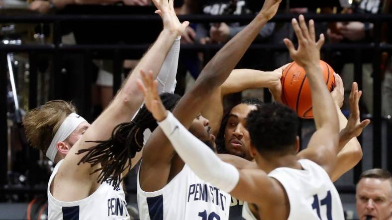 Penn State Nittany Lions forward Michael Henn (24), Penn State Nittany Lions guard Evan Mahaffey (12) and Penn State Nittany Lions guard Camren Wynter (11) defend Purdue Boilermakers forward Trey Kaufman-Renn (4) during the NCAA men   s basketball game, Wednesday, Feb. 1, 2023, at Mackey Arena in West Lafayette, Ind. Purdue won 80-60.

Purpennmbb020123 Am17331