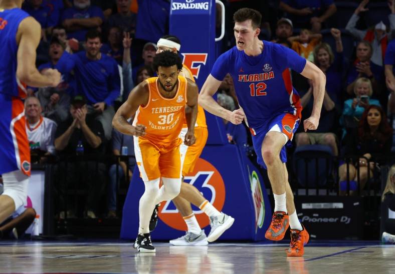 Feb 1, 2023; Gainesville, Florida, USA;Florida Gators forward Colin Castleton (12) celebrates after he makes a basket against the Tennessee Volunteers  during the second half at Exactech Arena at the Stephen C. O'Connell Center. Mandatory Credit: Kim Klement-USA TODAY Sports