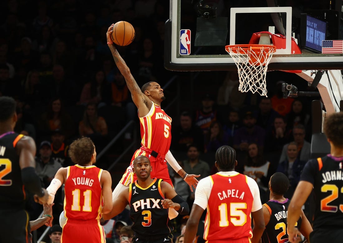 Feb 1, 2023; Phoenix, Arizona, USA; Atlanta Hawks guard Dejounte Murray (5) slam dunks the ball against the Phoenix Suns in the first half at Footprint Center. Mandatory Credit: Mark J. Rebilas-USA TODAY Sports