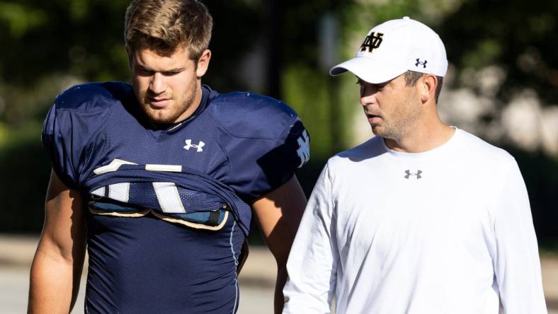 Notre Dame's Michael Mayer and offensive coordinator Tommy Rees prior to Notre Dame Fall Practice on Friday, August 12, 2022, at Irish Athletics Center in South Bend, Indiana.

Ncaa Foorball 2022 Notre Dame Fall Practice