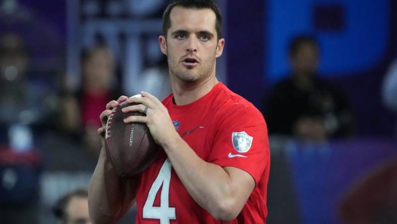 Feb 2, 2023; Henderson, NV, USA; Las Vegas Raiders quarterback Derek Carr (4) throws the ball during the Pro Bowl Skills competition at the Intermountain Healthcare Performance Facility. Mandatory Credit: Kirby Lee-USA TODAY Sports