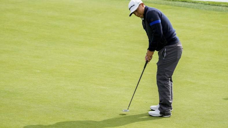 February 3, 2023; Pebble Beach, California, USA; Kurt Kitayama putts on the eighth hole during the second round of the AT&T Pebble Beach Pro-Am golf tournament at Pebble Beach Golf Links. Mandatory Credit: Ray Acevedo-USA TODAY Sports