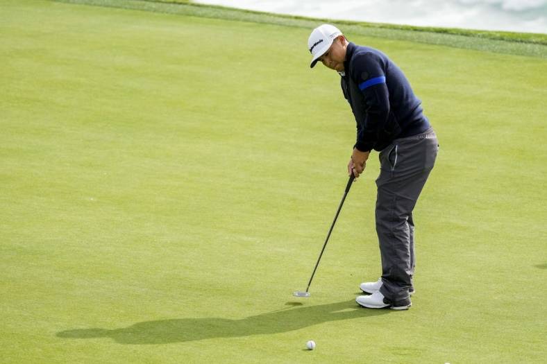 February 3, 2023; Pebble Beach, California, USA; Kurt Kitayama putts on the eighth hole during the second round of the AT&T Pebble Beach Pro-Am golf tournament at Pebble Beach Golf Links. Mandatory Credit: Ray Acevedo-USA TODAY Sports