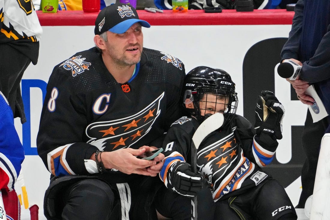 Feb 3, 2023; Sunrise, Florida, USA; Washington Capitals left wing Alex Ovechkin (8) with his son Sergei during the 2023 NHL All-Star Skills Competition at FLA Live Arena. Mandatory Credit: Jasen Vinlove-USA TODAY Sports