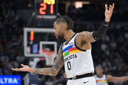 Feb 3, 2023; Minneapolis, Minnesota, USA; Minnesota Timberwolves guard D'Angelo Russell (0) reacts during the third quarter against the Orlando Magic at Target Center. Mandatory Credit: Jeffrey Becker-USA TODAY Sports