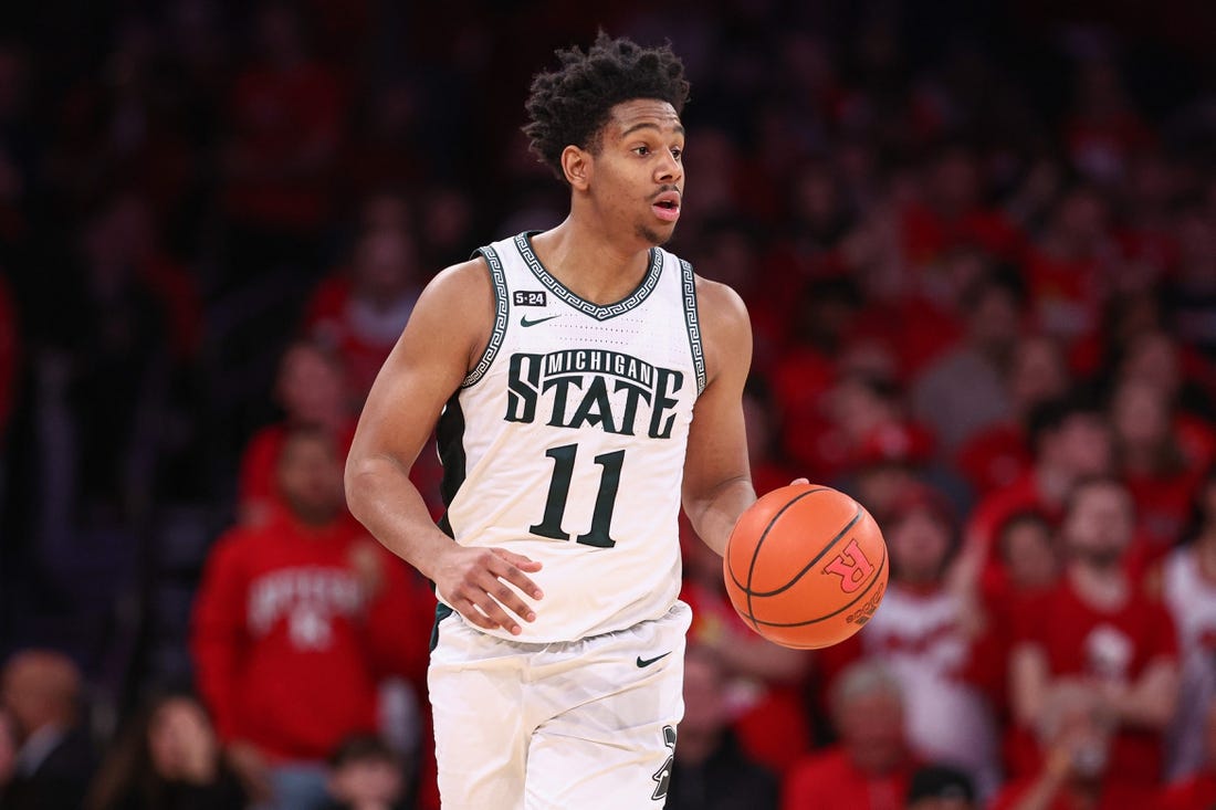 Feb 4, 2023; New York, New York, USA; Michigan State Spartans guard A.J. Hoggard (11) dribbles up court during the second half against the Rutgers Scarlet Knights at Madison Square Garden. Mandatory Credit: Vincent Carchietta-USA TODAY Sports