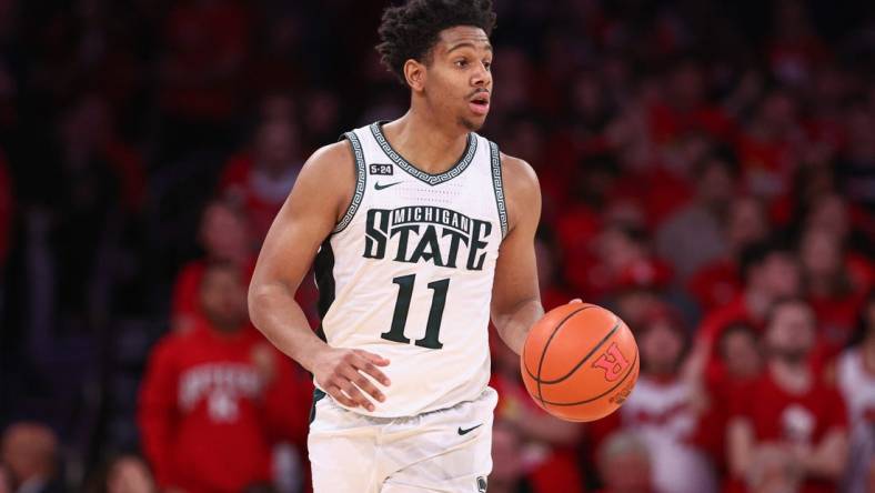 Feb 4, 2023; New York, New York, USA; Michigan State Spartans guard A.J. Hoggard (11) dribbles up court during the second half against the Rutgers Scarlet Knights at Madison Square Garden. Mandatory Credit: Vincent Carchietta-USA TODAY Sports