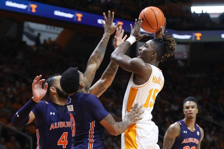 Feb 4, 2023; Knoxville, Tennessee, USA; Tennessee Volunteers guard Jahmai Mashack (15) goes to the basket against Auburn Tigers guard K.D. Johnson (0) during the first half at Thompson-Boling Arena. Mandatory Credit: Randy Sartin-USA TODAY Sports