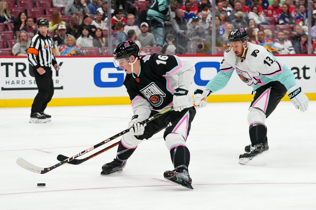 Feb 4, 2023; Sunrise, Florida, USA; Atlantic Division forward Mitchell Marner (16) of the Toronto Maple Leafs battles for the puck against Metropolitan Division forward Kevin Hayes (13) of the Philadelphia Flyers during the second period of a semifinal game during the 2023 NHL All-Star Game at FLA Live Arena. Mandatory Credit: Jasen Vinlove-USA TODAY Sports