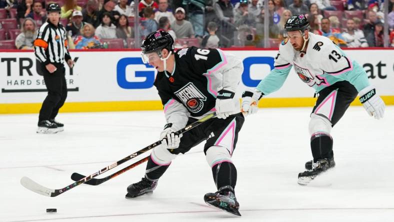 Feb 4, 2023; Sunrise, Florida, USA; Atlantic Division forward Mitchell Marner (16) of the Toronto Maple Leafs battles for the puck against Metropolitan Division forward Kevin Hayes (13) of the Philadelphia Flyers during the second period of a semifinal game during the 2023 NHL All-Star Game at FLA Live Arena. Mandatory Credit: Jasen Vinlove-USA TODAY Sports