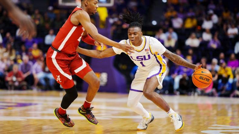 Feb 4, 2023; Baton Rouge, Louisiana, USA; LSU Tigers guard Cam Hayes (1) fights for position against Alabama Crimson Tide forward Brandon Miller (24) during the first half at Pete Maravich Assembly Center. Mandatory Credit: Andrew Wevers-USA TODAY Sports