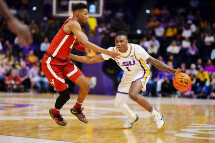 Feb 4, 2023; Baton Rouge, Louisiana, USA; LSU Tigers guard Cam Hayes (1) fights for position against Alabama Crimson Tide forward Brandon Miller (24) during the first half at Pete Maravich Assembly Center. Mandatory Credit: Andrew Wevers-USA TODAY Sports