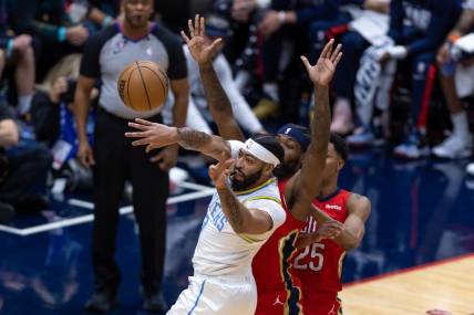 Feb 4, 2023; New Orleans, Louisiana, USA;  Los Angeles Lakers forward Anthony Davis (3) passes the ball against New Orleans Pelicans guard Trey Murphy III (25) during the first half at Smoothie King Center. Mandatory Credit: Stephen Lew-USA TODAY Sports