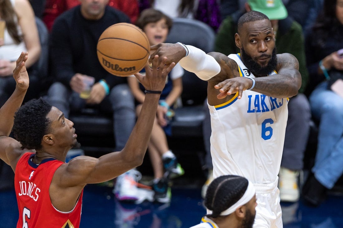 Feb 4, 2023; New Orleans, Louisiana, USA;  Los Angeles Lakers forward LeBron James (6) passes the ball against New Orleans Pelicans forward Herbert Jones (5) during the second half at Smoothie King Center. Mandatory Credit: Stephen Lew-USA TODAY Sports