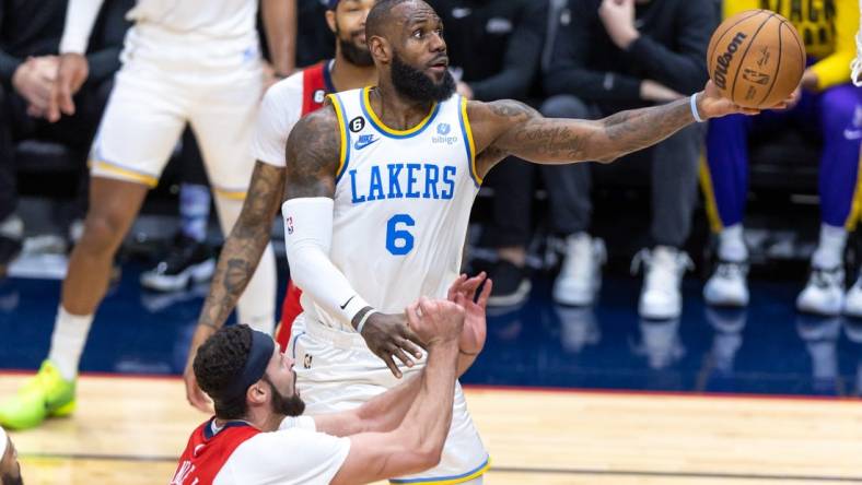 Feb 4, 2023; New Orleans, Louisiana, USA;  Los Angeles Lakers forward LeBron James (6) drives to the basket against New Orleans Pelicans forward Larry Nance Jr. (22) during the second half at Smoothie King Center. Mandatory Credit: Stephen Lew-USA TODAY Sports