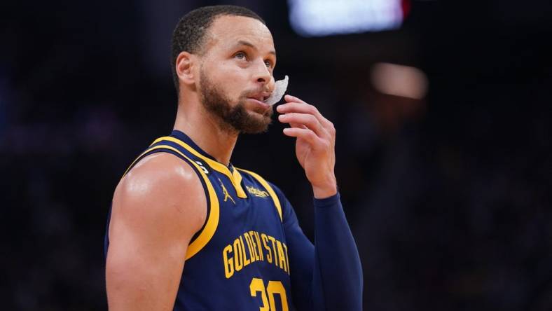 Feb 4, 2023; San Francisco, California, USA; Golden State Warriors guard Stephen Curry (30) stands on the court during a break in the action against the Dallas Mavericks in the third quarter at the Chase Center. Mandatory Credit: Cary Edmondson-USA TODAY Sports