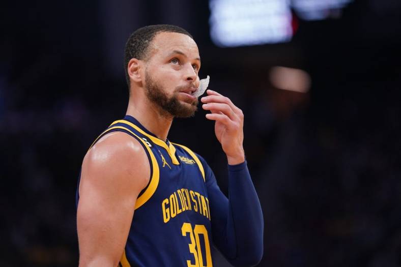 Feb 4, 2023; San Francisco, California, USA; Golden State Warriors guard Stephen Curry (30) stands on the court during a break in the action against the Dallas Mavericks in the third quarter at the Chase Center. Mandatory Credit: Cary Edmondson-USA TODAY Sports