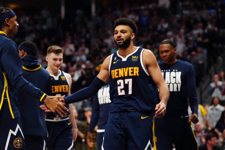 Feb 4, 2023; Denver, Colorado, USA; Denver Nuggets guard Jamal Murray (27) celebrates a play in the fourth quarter against the Atlanta Hawks at Ball Arena. Mandatory Credit: Ron Chenoy-USA TODAY Sports