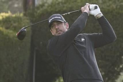 Feb 5, 2023; Pebble Beach, California, USA; Aaron Rodgers hits his tee shot on the fifteenth hole during the third round of the AT&T Pebble Beach Pro-Am golf tournament at Pebble Beach Golf Links. Mandatory Credit: Ray Acevedo-USA TODAY Sports