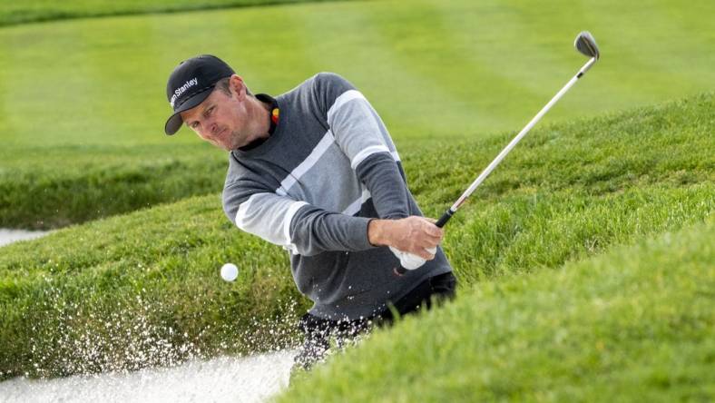 February 5, 2023; Pebble Beach, California, USA; Justin Rose hits his bunker shot on the second hole during the final round of the AT&T Pebble Beach Pro-Am golf tournament at Pebble Beach Golf Links. Mandatory Credit: Kyle Terada-USA TODAY Sports