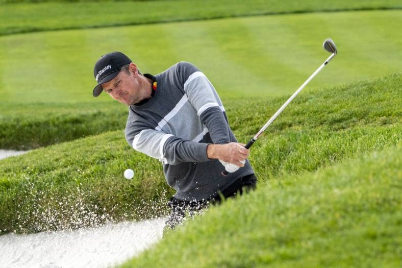 February 5, 2023; Pebble Beach, California, USA; Justin Rose hits his bunker shot on the second hole during the final round of the AT&T Pebble Beach Pro-Am golf tournament at Pebble Beach Golf Links. Mandatory Credit: Kyle Terada-USA TODAY Sports